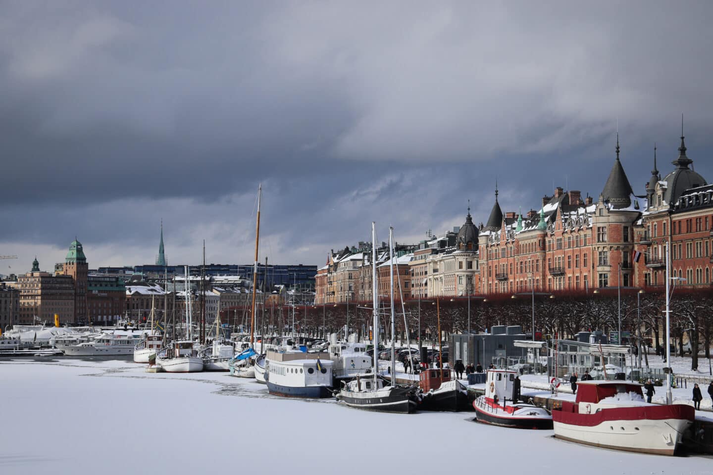 Stockholm in the snow - a picture of Stanvagan - frozen waters in the foreground, cloudy skies in the background. 